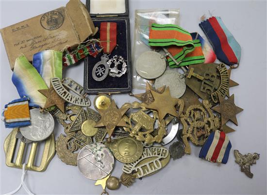 A quantity of assorted of medals and badges.